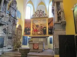 Chancel of the church with altar and baptismal font