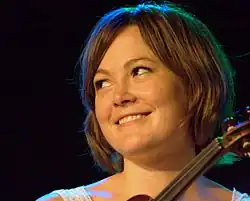 Sara Watkins holding a fiddle