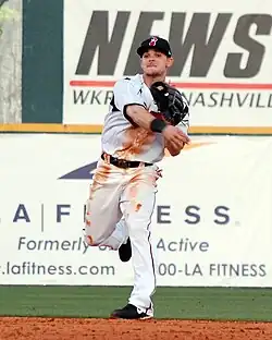 A baseball player in white