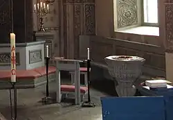 Free-standing sedile or chair with desk in Alsike Kyrka, Knivsta, Sweden