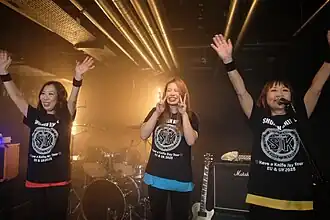 Members of Shonen Knife pictured in 2025 (L-R: Atsuko Yamano, Risa Kawano, Naoko Yamano)