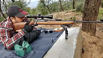 Shooter taking aim with his IOF .30-06 Sporting Rifle with Tasco 3-9x 40&nbsp;mm Riflescope and Haris Bipod mounted at a private range in J&K, India