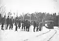 Skiers waiting for the streetcar, Rockliffe Park, c1913