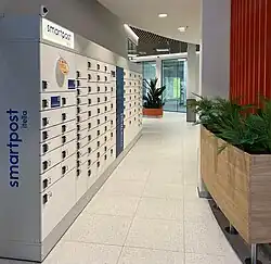 Smartpost's modern white parcel locker in Stockmann mall in Tallinn