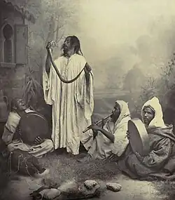 Image 19 Snake charming Photo: Tancrède Dumas; Restoration: Lise Broer A late nineteenth century photo of snake charmers in Tangier, Morocco. Snake charming is the practice of apparently hypnotising a snake, and the performance may use musical instruments and other street performance techniques. The practice as it exists today probably arose in India, where it remains widely practiced, and spread throughout Southeast Asia, the Middle East, and North Africa. More selected pictures