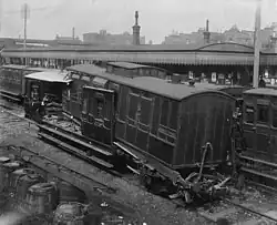 The aftermath of the 1898 St Johns rail accident, where the rear two carriages of a passenger train were telescoped by being hit at 8&nbsp;mph (13&nbsp;km/h) by a following train.