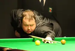 Stephen Lee playing a shot