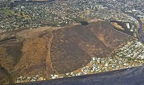 Aerial view of Tygerberg Nature Reserve in the southernmost Tierberg. The Plattekloof and Welgemoed (above) suburbs flank the mountain, while the N1 highway skirts its southern limit.