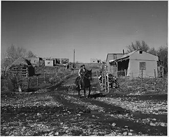 "Arroyo Seco. Note road, transportation by horse, typical structure of outbuildings," December 1941