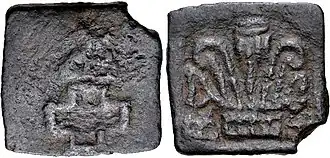 Taxila coin, with hill, empty cross and palmette (180–160 BCE)