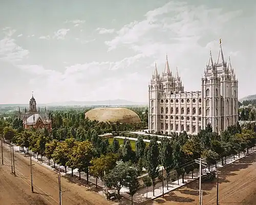 Image 4 Temple Square Photo: William Henry Jackson; restoration: Tom dl and Mmxx An 1899 photochrom showing Temple Square, a 10-acre (4.0 ha) complex located in the center of Salt Lake City, Utah, US. The location is owned by and serves as headquarters of the Church of Jesus Christ of Latter-day Saints and was selected by Church president Brigham Young in 1846. Temple Square is home to several buildings; depicted here are the Salt Lake Temple, Salt Lake Tabernacle and Salt Lake Assembly Hall. More featured pictures