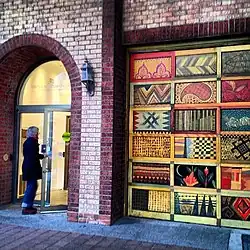 Bricked exterior facade of the main entrance to the Textile Museum of Canada