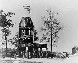 A 64-foot-tall (20&nbsp;m) Nehi Bottle located near Auburn, Alabama, in an area referred to as "The Bottle" (destroyed by fire in 1933)