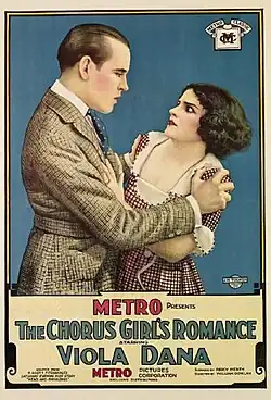 Poster for the 1920 silent film The Chorus Girl's Romance depicting a man in a suit gripping a young woman, actress Viola Dana, by the shoulders.