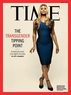Front cover of a June 2014 issue of Time magazine, featuring a full-body photo of Laverne Cox. Cox is wearing a blue dress and is standing in a white background.