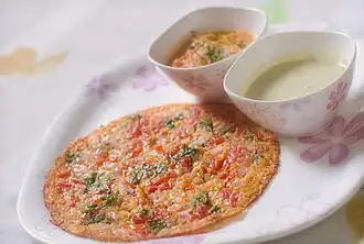 Uttapam is one of the many varieties of dosa prepared in India and served for breakfast.