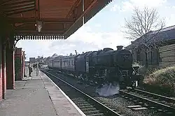 A local train waits to stop at Rugby Central in September 1966, shortly before the line was closed as a through route.