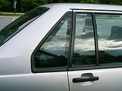Two non-movable quarter windows of a Volvo 940, one as part of door and a second mounted in the C-pillar