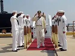 President Jimmy Carter salutes the sideboys after departing the USS Jimmy Carter (SSN-23)
