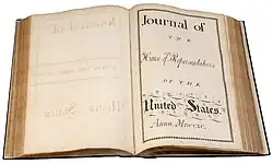 The first page spread opened of the Journal of the United States House of Representatives.