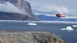 Air Greenland Bell 212 helicopter approaching helipad