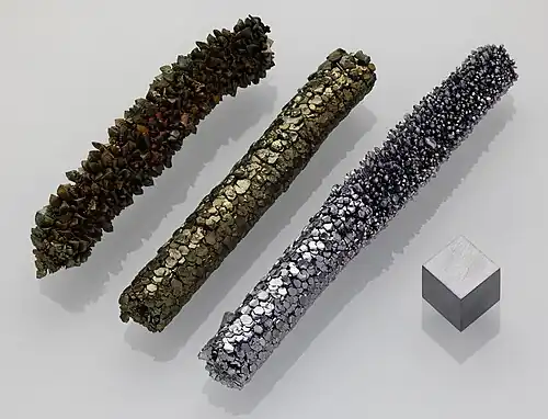 A disc of vanadium metal on a very small scale