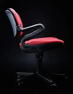 Castelli [it] Vertabrae chair by Emilio Ambasz and Giancarlo Piretti (1981 award)[44]