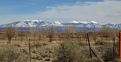 A modern photograph of the LaSal mountains from the vantage point of Dalton Wells.