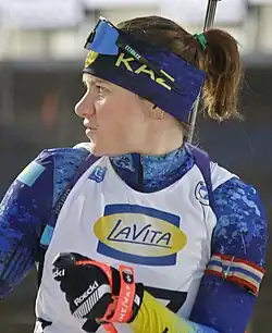 Galing Vishnevskaya from the torso up wearing biathlon gear.