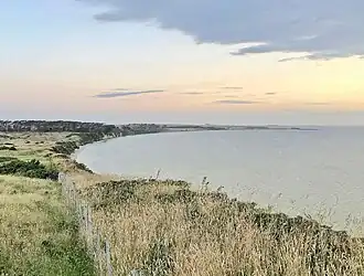 Waikato Point. Cliffs rise to about 30&nbsp;m (98&nbsp;ft) on the west coast of the lagoon