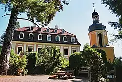 Building with many windows, detached tower