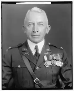 Black and white head and shoulders facing front photo of Lorenzo Dow Gasser in dress uniform with military awards, circa 1930