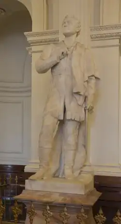 Marble statue of Sam Houston on a stone pedestal