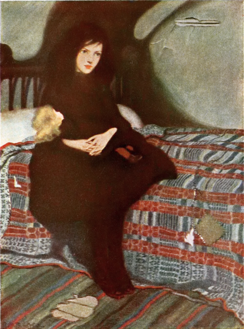 a girl sitting on a bed with a doll on her lap