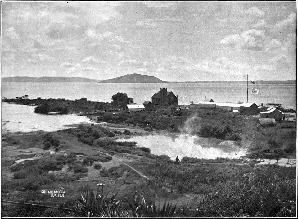 Lakeside church with steaming pool in foreground.
