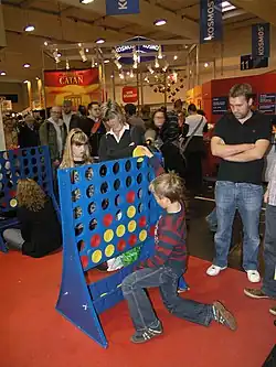 Children playing giant Connect Four.