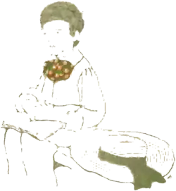 A boy seated with a book