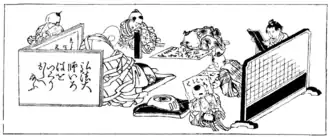 Buddhist Priest teaching the alphabet to young children