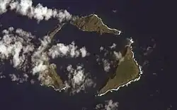 Satellite photograph of the northern islands: green islands in the blue sea, partly obscured by clouds.