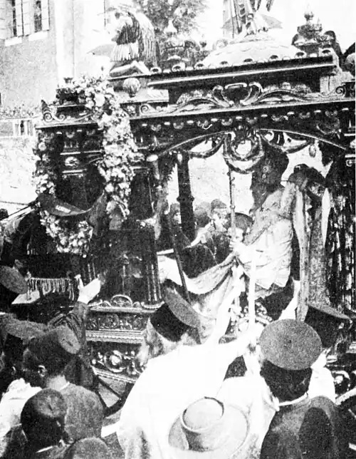 The dead Patriarch being driven through the streets of Beirut in his gilded chariot