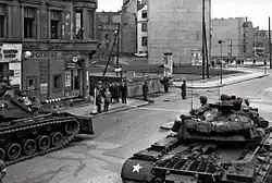 Black and white photograph of US tanks at Checkpoint Charlie in 1961