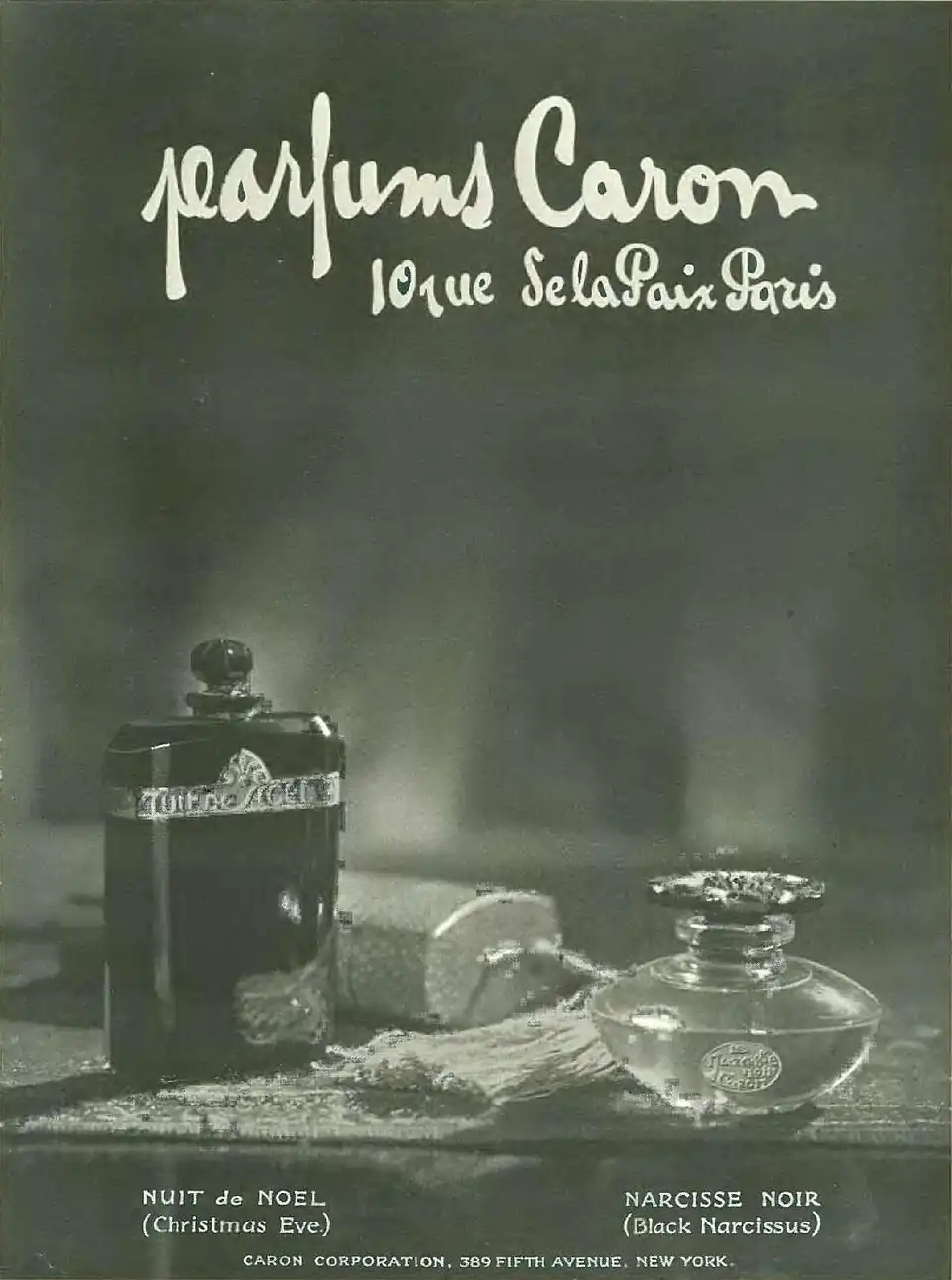 An ad for perfume with the bottles on a table and the titles Nuit de Noel (Christmas Eve) and Narcisse Noir (Black Narcissus)