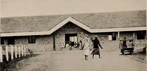 A building with pedestrians walking by it