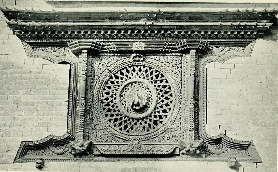 Black and white photograph of a window of carved wood at Bhatgaon.